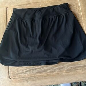 Classic black tennis skirt with shots attached